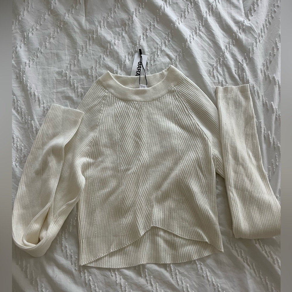 Tight white comfy shirt.